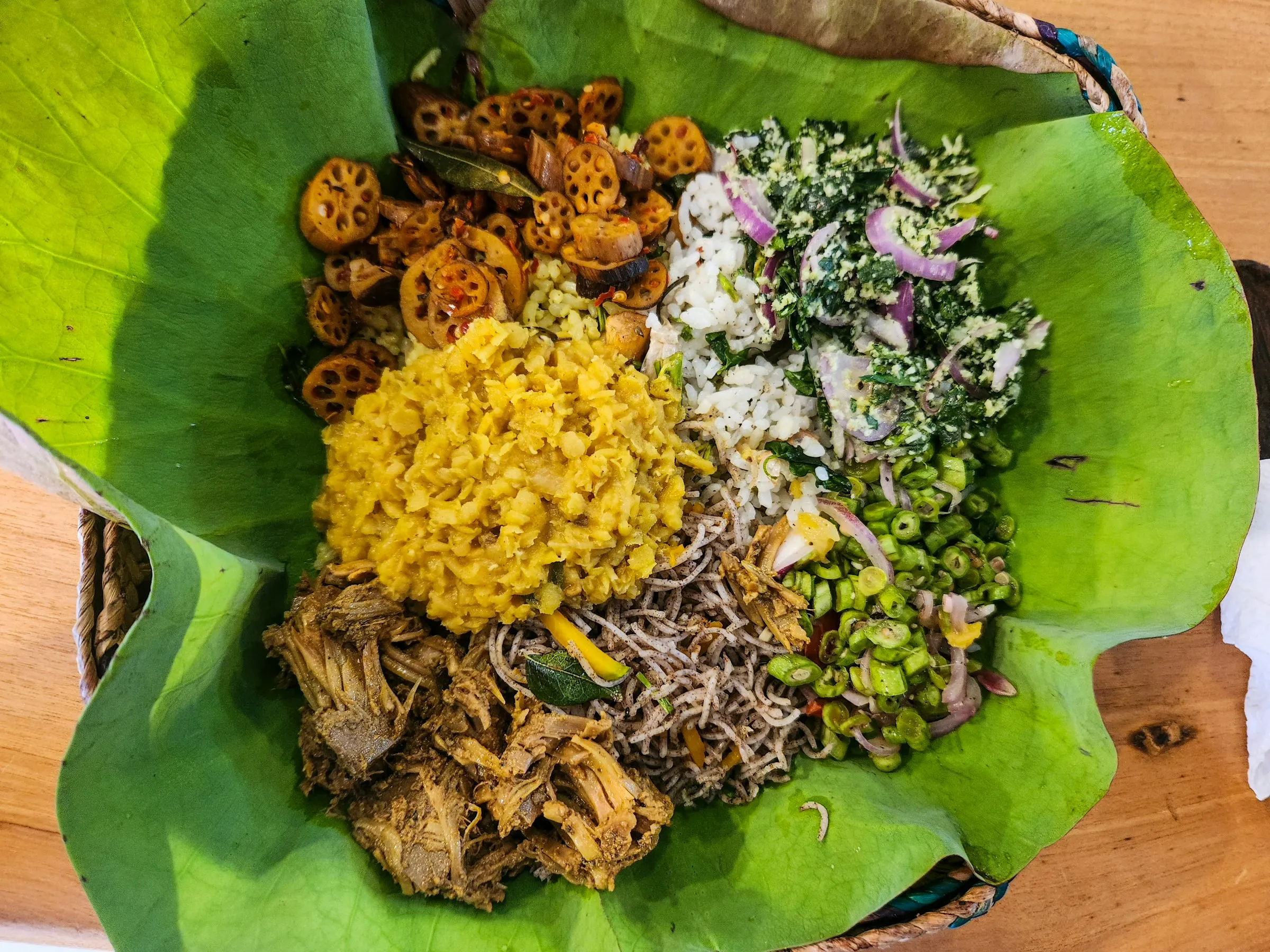 A Sri Lankan meal served on a leaf: rice, curries and sambols